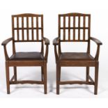 A pair of Gordon Russell oak elbow chairs, designed 1925, seat height 46cm Design No 281 in the
