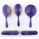 A George V five piece silver and purple guilloche enamel brush set, by William Comyns & Sons Ltd,