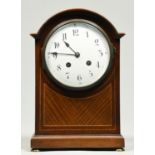 A mahogany and broken line inlaid breakarched mantel clock, c1920, with enamel dial, gong striking