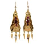A pair of Victorian foiled garnet set gold earrings, c1870, with three drops, 48mm excluding wire