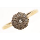 A diamond cluster ring, in 18ct gold, 2.6g, size P½ Setting rubbed