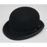 A Lock & Co black felt bowler hat with black cotton border and ribbon, in original Lock & Co Hatters