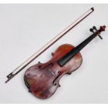 A German violin, c1900, labelled The Haydn, length of back 35.5cm and a violin bow, cased Much wear,