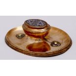A Victorian oval brass and champleve enamel inkwell, c1880, the urn shaped inkwell on dished base