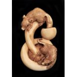 A Japanese ivory netsuke of rats and a mushroom, circa early 20th c, 55mm l, signed Slight