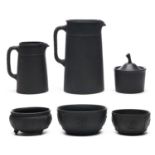 A group of Wedgwood black basalt wares, late 19th and 20th c,  plain or sprigged, largest jug 19cm