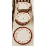 An Aynsley dessert service, c1930, printed and painted with pendant roses in claret and gilt rim,