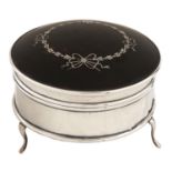 A George V round silver inlaid tortoiseshell inset silver trinket box,  on three feet, plush