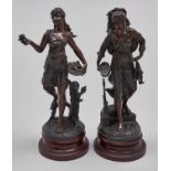 A pair of French fin de siecle patinated spelter statuettes, on stained wood socle, 46cm h Good