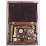 An English brass compound microscope, c1830, the pillar with rackwork and compass joint at the base,