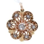 A rose diamond pendant,  in two colour gold, 24mm diam, 6.1g Good condition; one or two of the