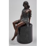 A bronze sculpture of a semi-naked woman, late 20th c, seated on cylindrical marble base, 17cm h