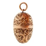 A George III egg shaped silver gilt nutmeg grater, crisply chased with flowers and scrolling foliage