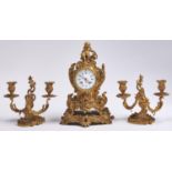 A French ormolu mantle clock, c1870,  in Louis XV style, surmounted by the seated figure of Putto,