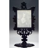 A set of four Plaue lithopanes and contemporary German ornate black painted iron frame, mid 19th