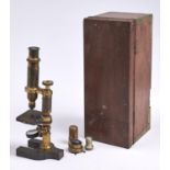 An English brass compound microscope, Baker 244 High Holborn London, c1870  the pillar with