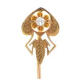 An art nouveau gold stickpin with diamond set terminal, c1910, head 15mm, marked SM&S 18k, 1.2g Good