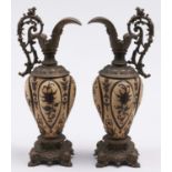 A pair of Continental spelter gilt mounted earthenware ewers, c1900, in 16th c style, the lobed