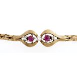A ruby and diamond centred two strand bracelet, in 9ct gold, 7.7g Good condition