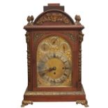 A Victorian mahogany bracket clock, c1900, the arched brass dial with matted centre, three winding