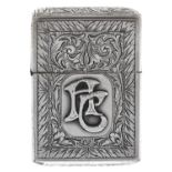 A Continental silver petrol lighter, c1930, foliate engraved and applied with monogram, 57cm h Light