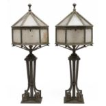 A pair of English Art Deco hexagonal bronze lanterns, c1930 the sides and hinged top with frosted