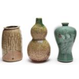 A Japanese stoneware jar, a mottled green glazed double gourd vase and a celadon vase decorated with