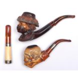 A Meerschaum tobacco pipe, the bowl carved as the head of a woman in a hat, c1900, amber mouthpiece,