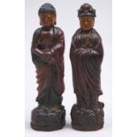 A pair of South East Asian polychrome wood figures, 20th c, in Ming style, on lotus base, 54 and