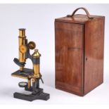 A brass compound microscope, Eclipse, Ross London, on trunnions with lever, focusing by rackwork