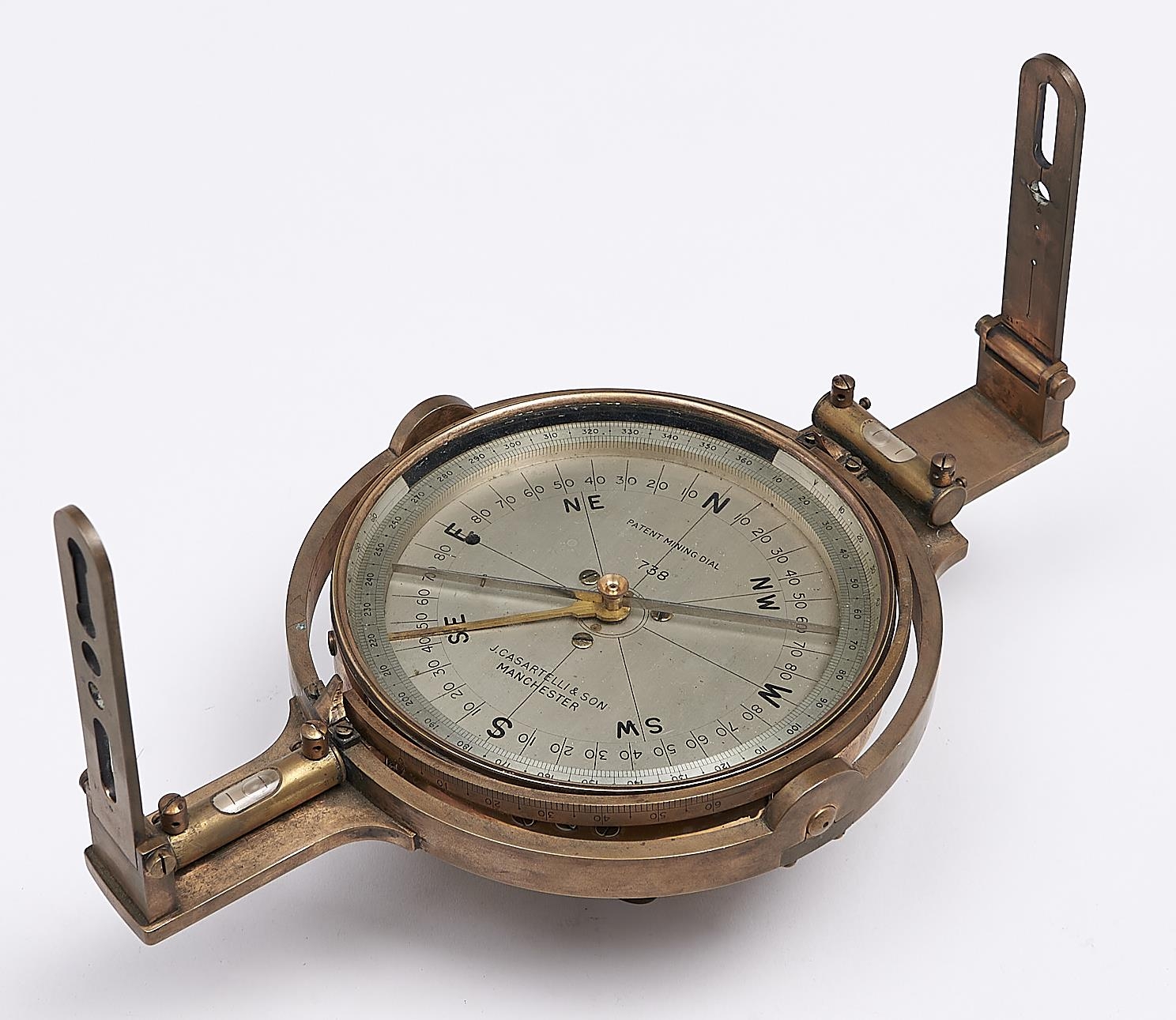 A brass miner's dial, J Casartelli & Son, Manchester, Patent Mining Dial No 738, with finely divided