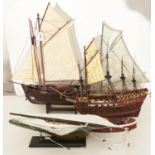 Three wooden model sailing boats, to include Mary Rose and two others and a white metal and glass
