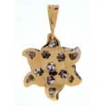 A two colour gold star shaped pendant, one side pierced, the other side textured, markled 750, 2.