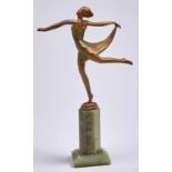 An Art Deco gilt patinated spelter statuette of a dancer cast from a Josef Lorenzl, c1930, on