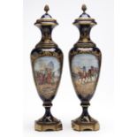 A pair of Sevres style brass mounted slender oviform vases, 20th c, painted by Chanele, both signed,