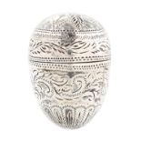 A George III egg shaped silver nutmeg grater, c1780, engraved with leaves and scrolling foliage,