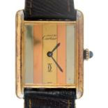A Cartier silver gilt wristwatch, Tank, with striped dial, mechanical movement, 23 x 23mm Good
