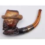 A Meerschaum tobacco pipe, the bowl carved as the head of a man in a hat, c1900, detachable silver