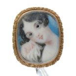 A gold brooch, early 19th c, set with a contemporary English School oblong portrait miniature of a