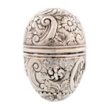 A George III egg shaped silver nutmeg grater, c1780, chased with c-scrolls and flowers, 33mm,