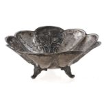 A Greek silver lobed repousse bowl, 19th c, on three feet, 13.5cm diam, 2ozs 15dwts Light wear