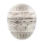 A George III engraved and bright cut egg shaped silver nutmeg grater, c1780, 37mm, unmarked, 16.