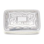 A George IV silver vinaigrette with die stamped grille, the lid engraved with foliate surround,