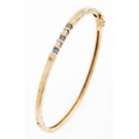 A sapphire and diamond bangle, in 9ct gold, 9.6g Good condition