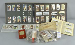 A box of cigarette cards and albums and with some tea cards