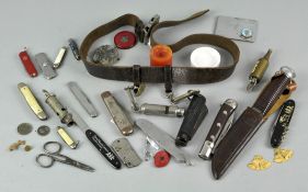 A collection of penknives and whistles