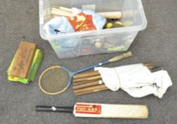 A cricket bat and stumps together with other sporting equipment