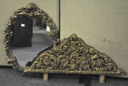 A gilt and decorated framed oval wall mirror,