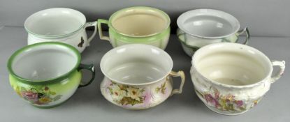 A collection of six ceramic chamber pots,