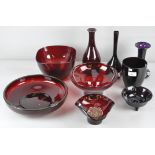 A collection of assorted ruby red glassware, to include some purple examples,